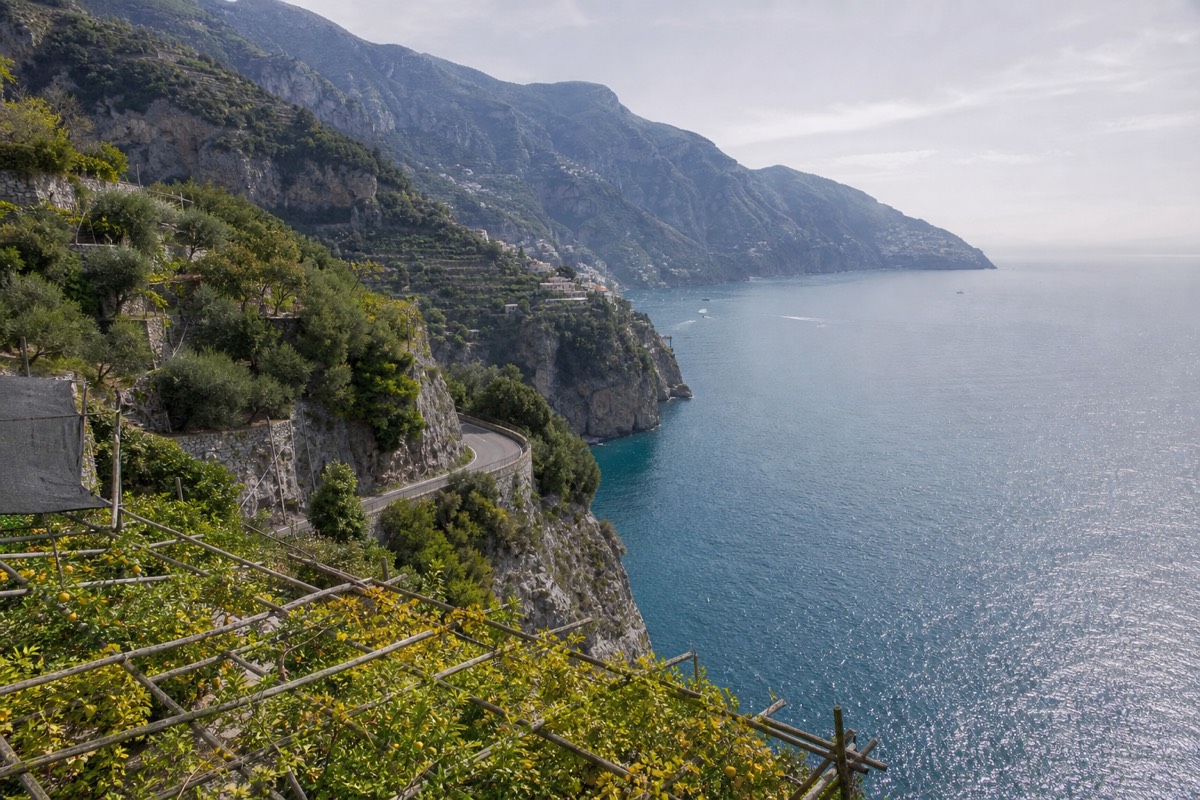 Positano's pastel houses stacked above the sea, a classic view on the Rome to Amalfi Coast route