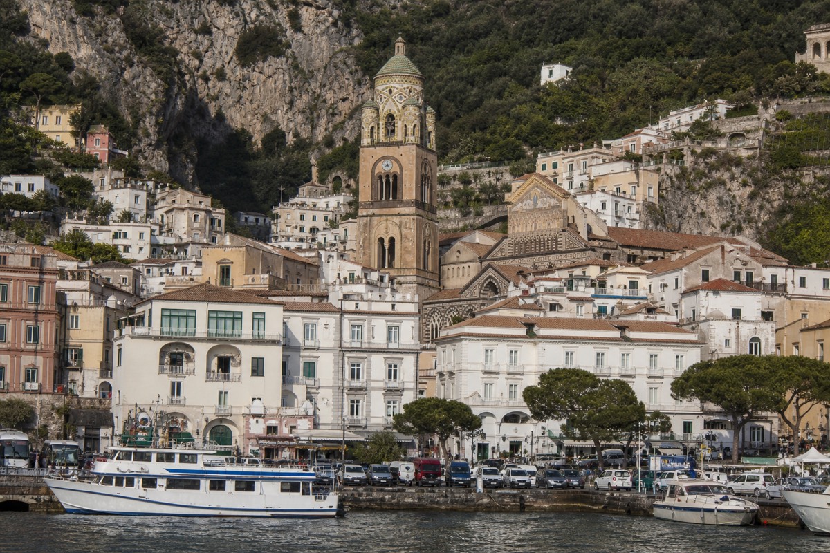 A view of Sorrento or Amalfi travellers often compare, with Amalfi cathedral rising above the harbour