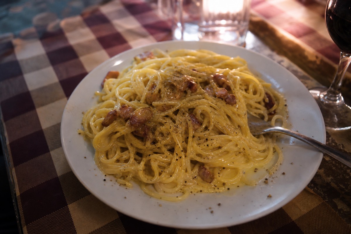 A plate of carbonara showing what to eat in Rome, a traditional Roman dish