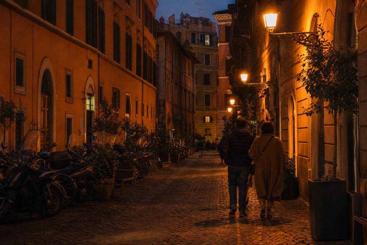 A busy cobbled street in central Rome in the evening, raising the question of is Rome safe for tourists